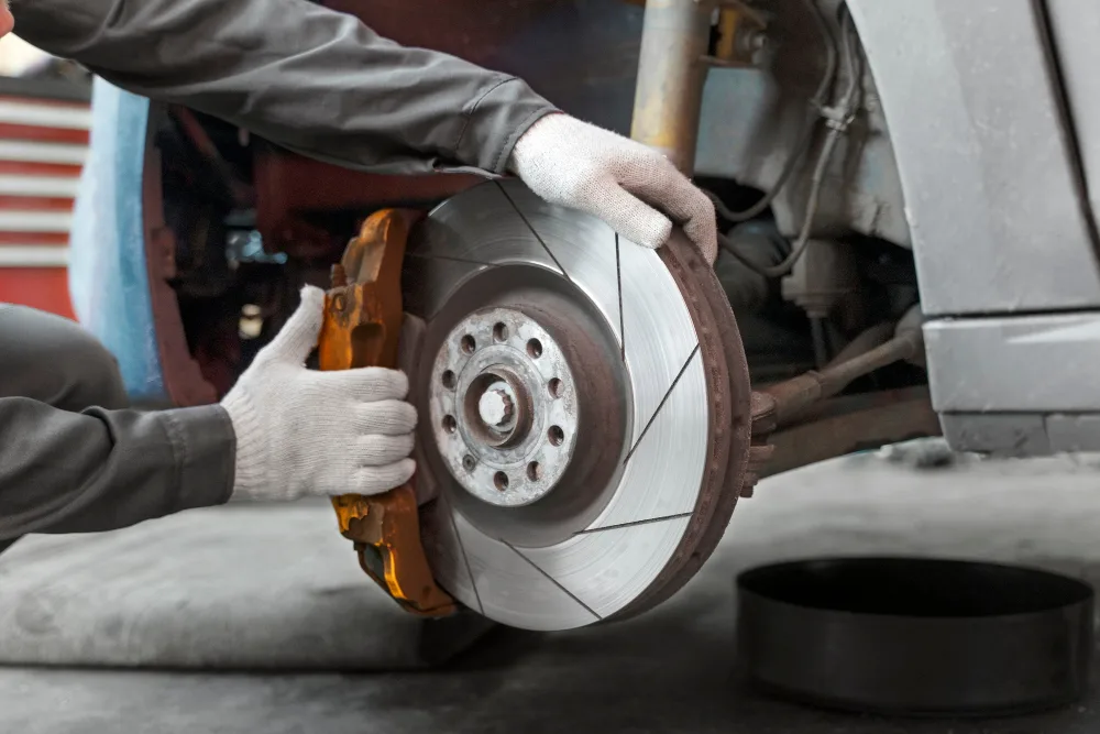 Mobile mechanic replacing brake pads and rotors in Perth