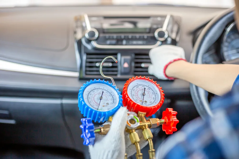 Mobile car air conditioning regas service with gauges in Perth