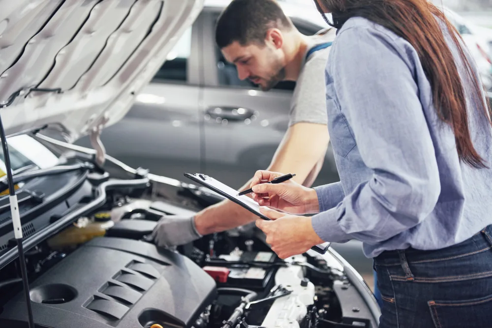 Mobile mechanic running engine diagnostics on a car in Perth