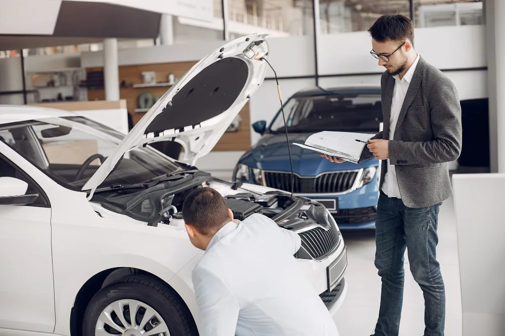 Mobile mechanic performing logbook servicing on a car in Perth